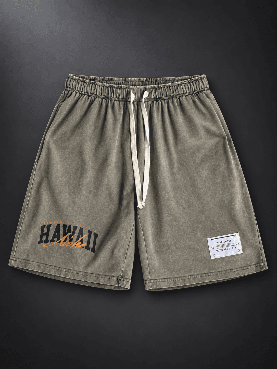 Front studio view of Vintage Green Japanese Hawaiian 7-inch shorts with cream drawstrings and Hawaii Aloha artwork.