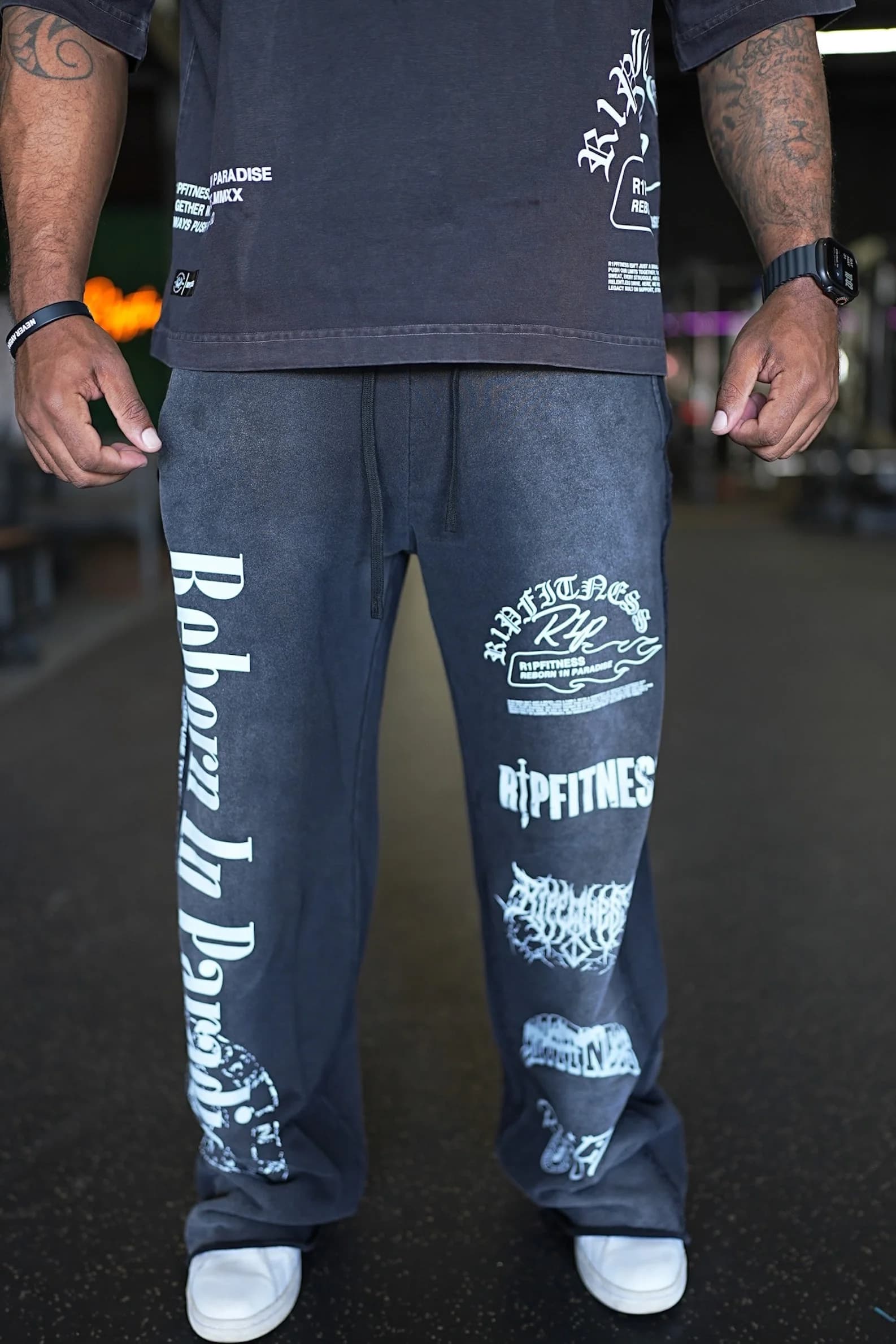 Front half view of R1PFITNESS Oversized Matching Sweatpants highlighting gourd graphic and khaki wash